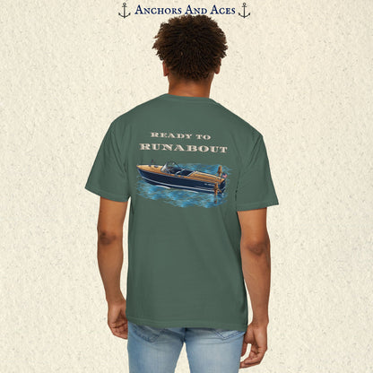 Model wearing a Blue Spruce classic wooden boat T-shirt from the back, featuring a vintage runabout on reflective blue water with Ready to Runabout text.