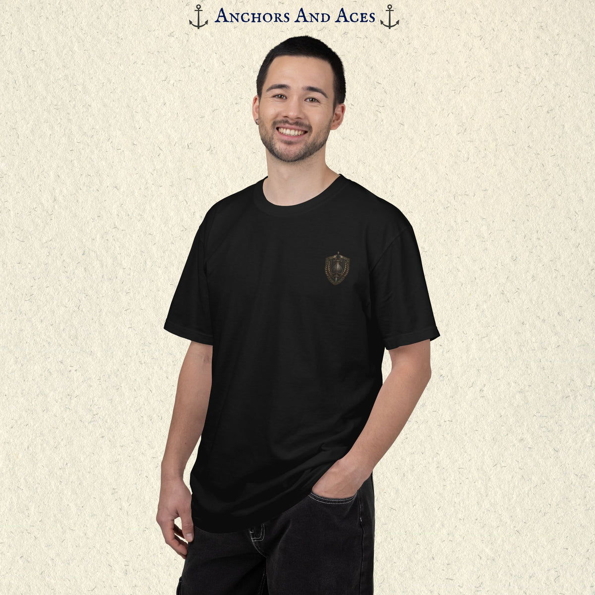 Front view of House of Spades graphic tee on a male model with small heraldic crest emblem on the chest.