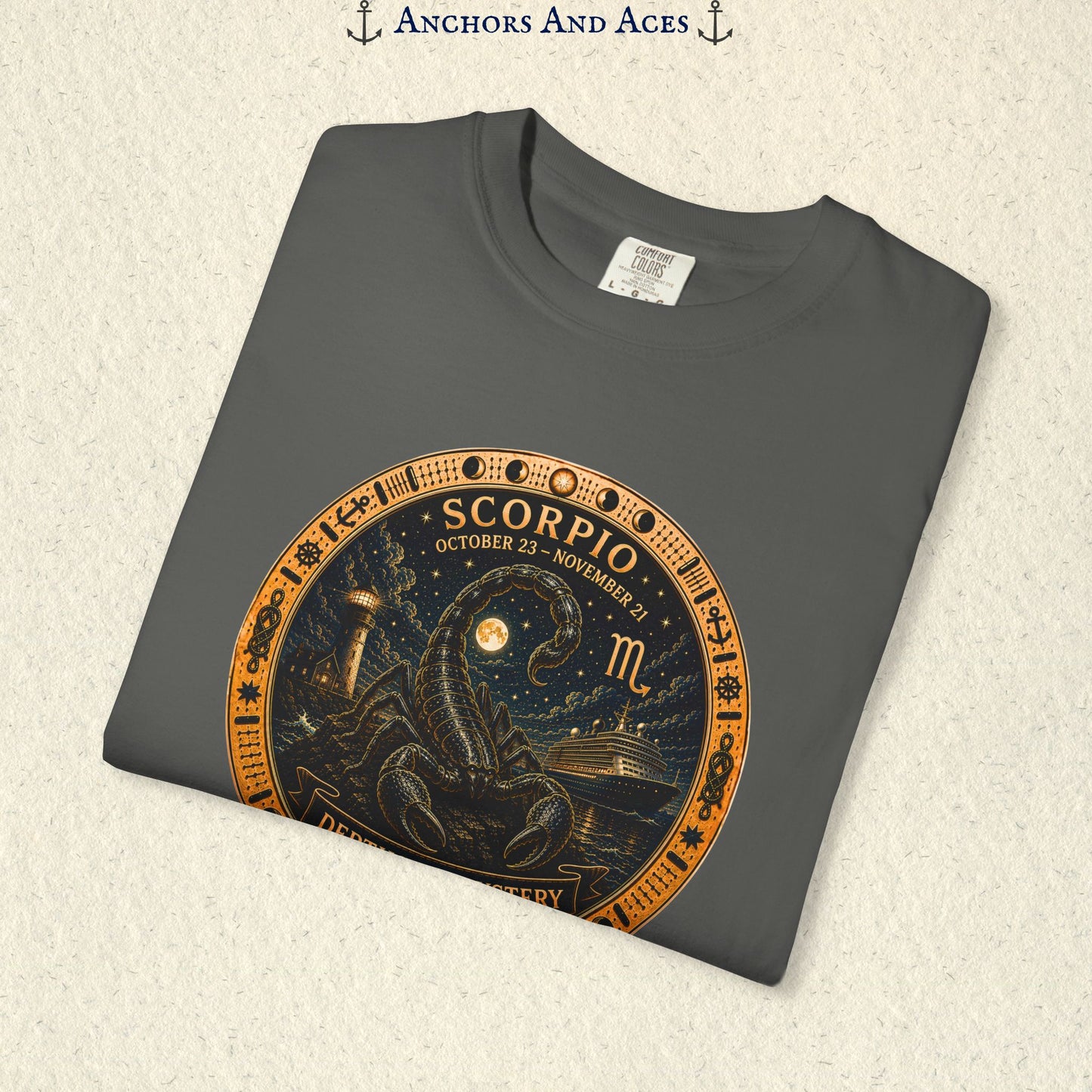 Folded Scorpio zodiac shirt close-up showing scorpion celestial medallion and Depths of Mystery artwork