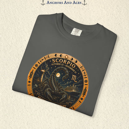 Folded Scorpio zodiac shirt close-up showing scorpion celestial medallion and Depths of Mystery artwork