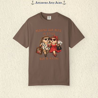 Personalized hedgehog gambling graphic tee with casino couple artwork, travel suitcase, playing cards, and Bob & Kathy custom text.
