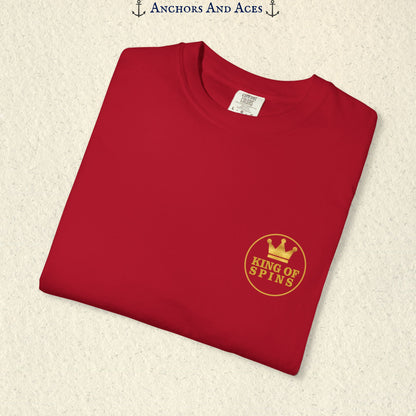 Folded Red Slot King T-shirt showing the small gold King of Spins chest emblem.