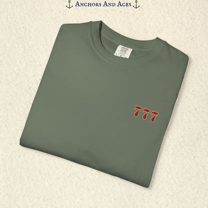Folded Moss Lucky 777s T-shirt showing the small red 777 casino emblem on the front chest.