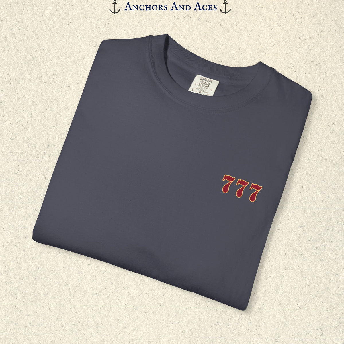 Folded Navy Lucky 777s T-shirt showing the small red 777 casino emblem on the front chest.