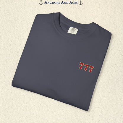 Folded Navy Lucky 777s T-shirt showing the small red 777 casino emblem on the front chest.
