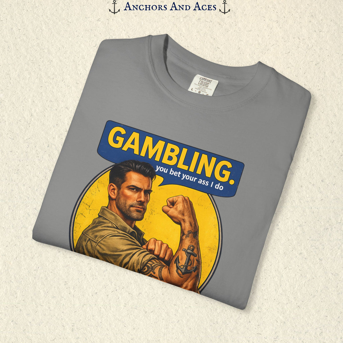 Folded Grey funny gambling T-shirt showing the retro strongman flexing beneath bold GAMBLING text.