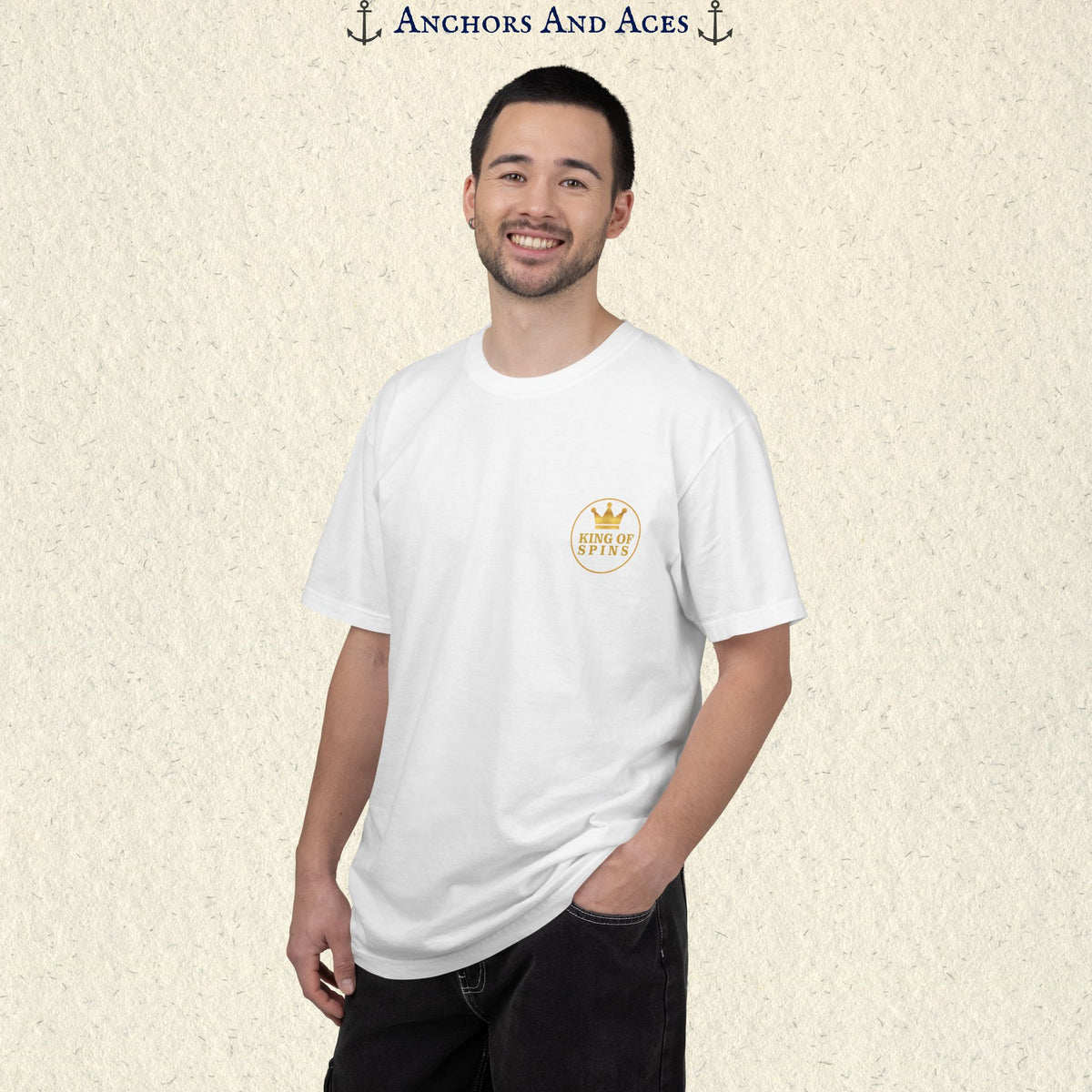 Man wearing a White Slot King T-shirt with the small gold King of Spins emblem on the front.