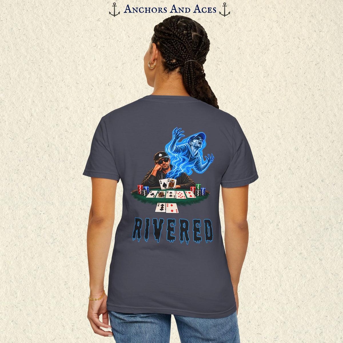 Model wearing RIVERED Texas Hold'em poker graphic tee back view featuring a player at a poker table with playing cards, poker chips, and an electric blue soul rising from his body after a bad beat on the river.  Comfort Colors 1717