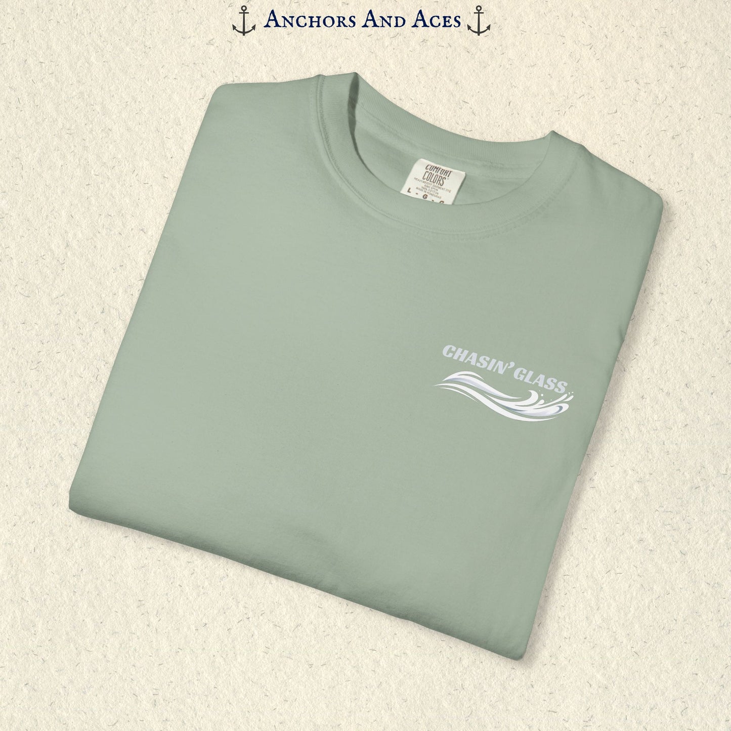 Folded Bay T-shirt showing the small white Chasin' Glass water splash logo on the left chest.