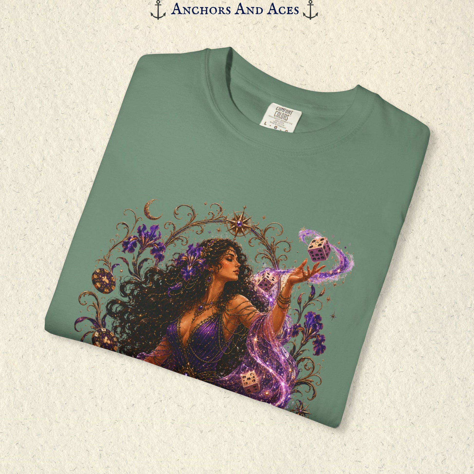 Close-up of Goddess of Chance Art Nouveau graphic on Bay Comfort Colors tee with illustrated goddess, dice, irises, and gold filigree.
