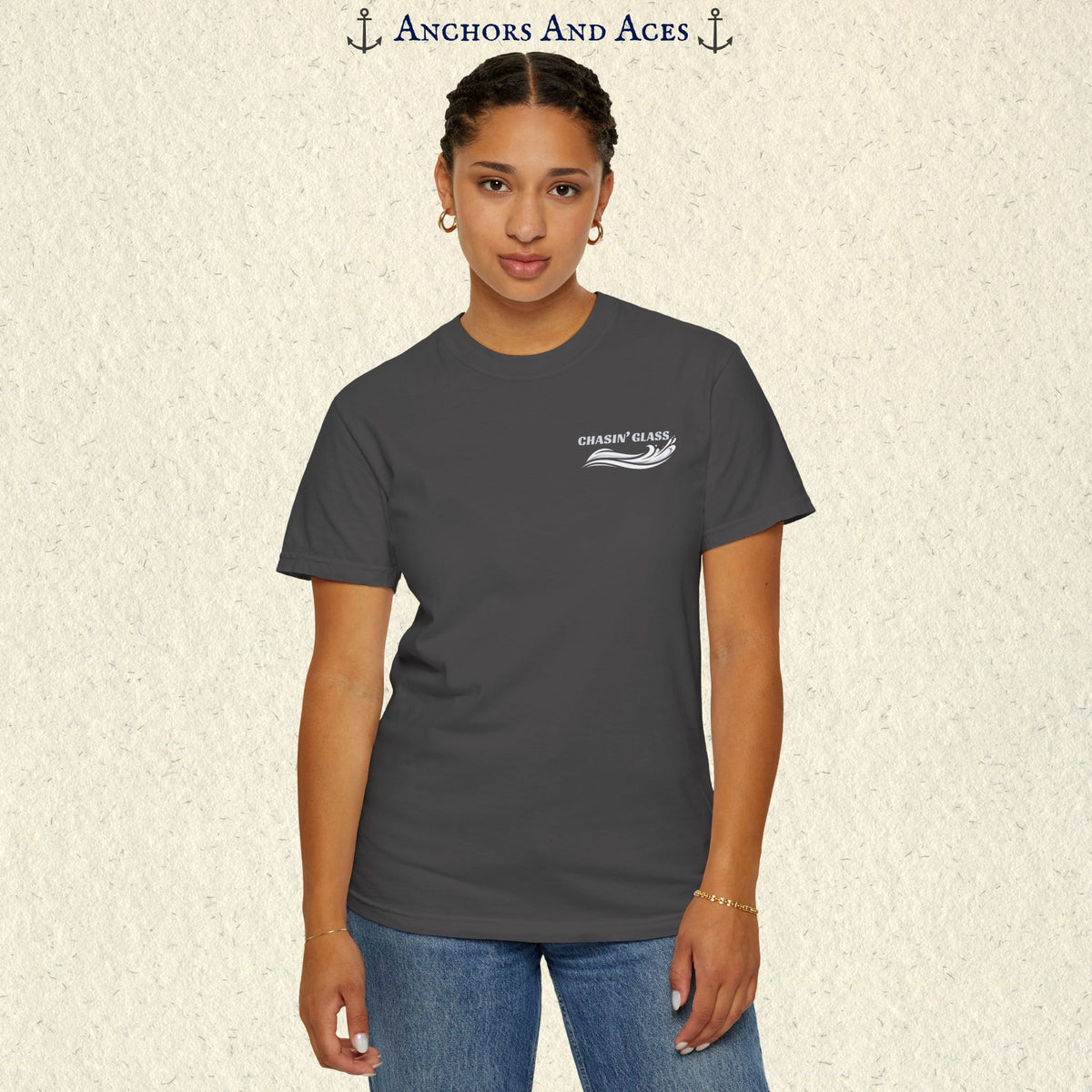 Model wearing a Graphite gray vintage water ski T-shirt, front view, with the small white Chasin' Glass text and stylized water splash logo on the left chest.