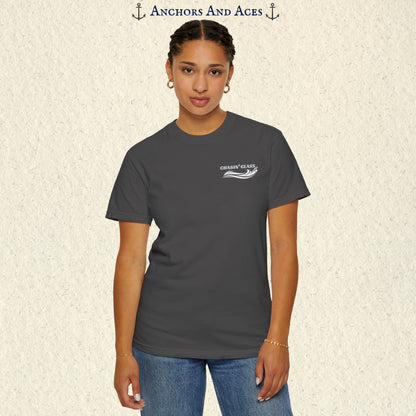 Model wearing a Graphite gray vintage water ski T-shirt, front view, with the small white Chasin' Glass text and stylized water splash logo on the left chest.