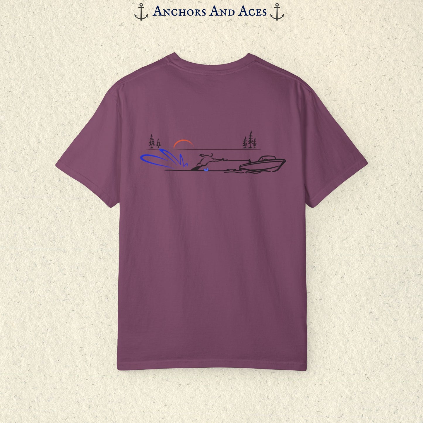 Brick Comfort Colors 1717 water ski shirt shown from the back, featuring minimalist line art of a ski boat pulling a slalom water skier across calm lake water at sunrise with pine trees and blue spray.
