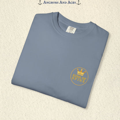 Folded Blue Jean Slot King T-shirt showing the small gold King of Spins chest emblem.