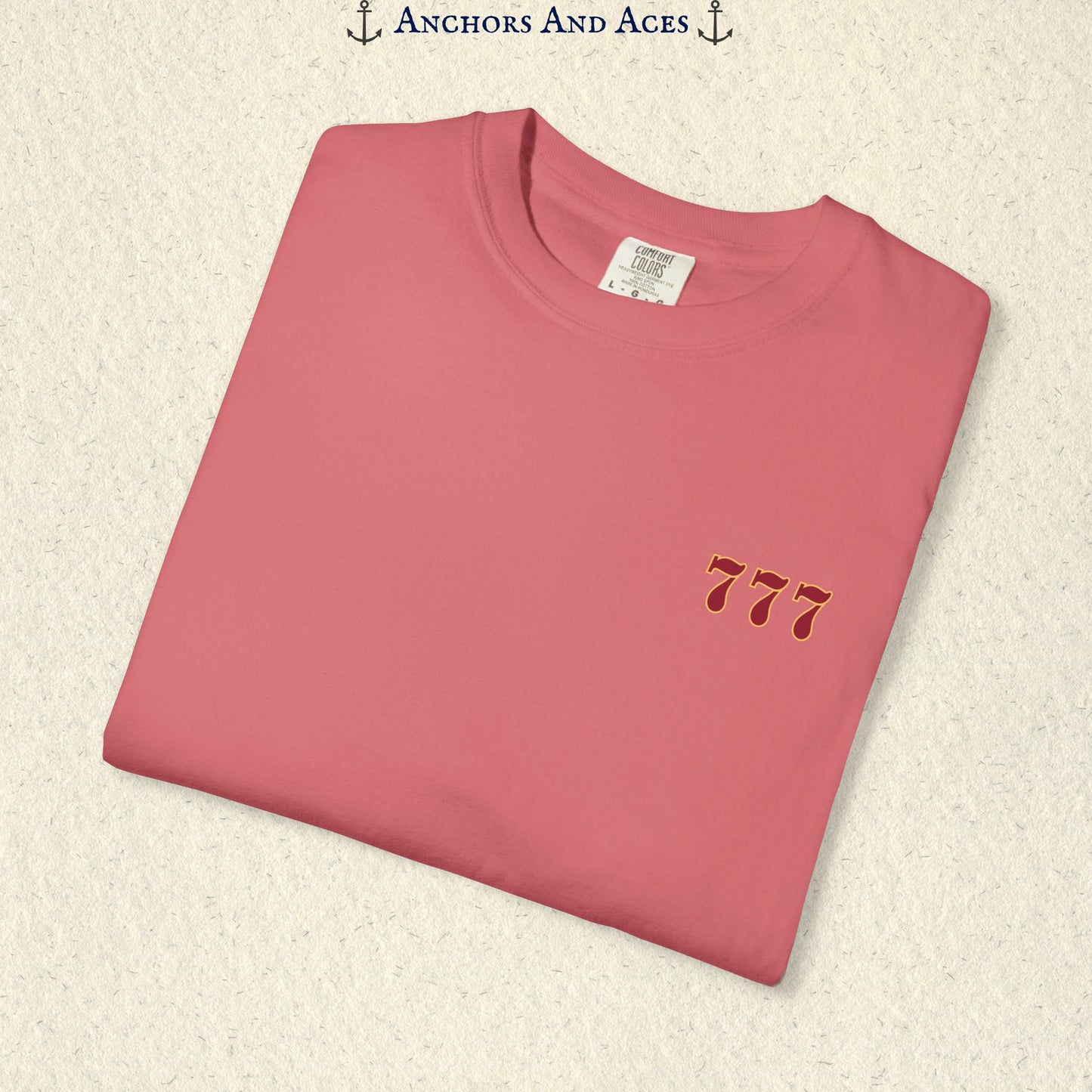 Folded Watermelon Lucky 777s T-shirt showing the small red 777 casino emblem on the front chest.