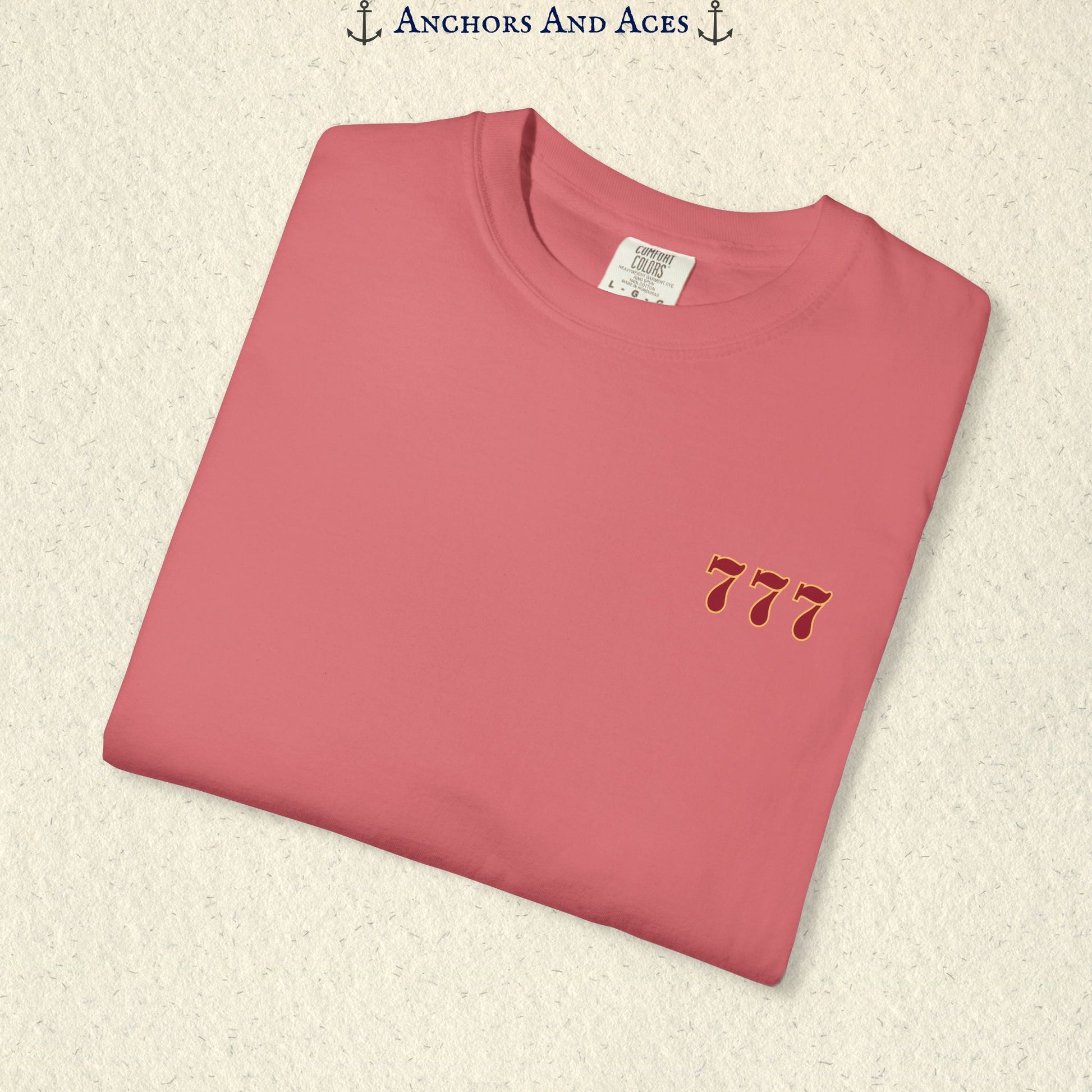 Folded Watermelon Lucky 777s T-shirt showing the small red 777 casino emblem on the front chest.
