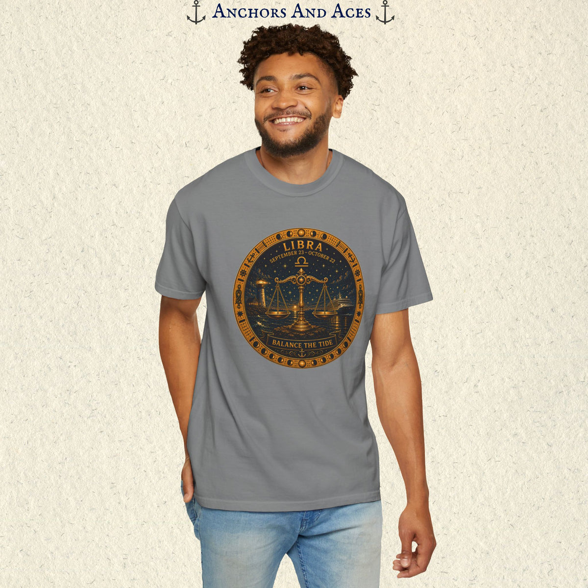 Male model wearing the Libra Zodiac Shirt with the full-size balance scales celestial medallion graphic on the front.