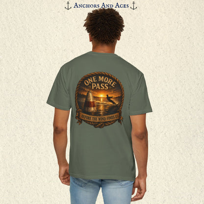Model wearing a Moss green vintage slalom water ski T-shirt, back view, with sunrise lake artwork featuring a slalom buoy, water skier, rope border, and One More Pass text.