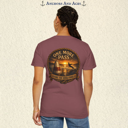 Model wearing a Brick red vintage slalom water ski T-shirt, back view, with sunrise lake artwork featuring a slalom buoy, water skier, rope border, and One More Pass text.