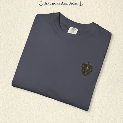 Folded House of Spades playing card shirt showing the small coordinating heraldic crest emblem on the front.