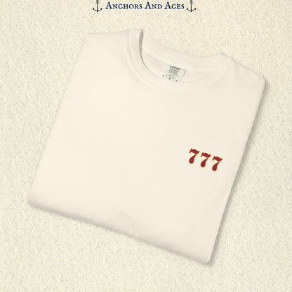 Folded Ivory Lucky 777s T-shirt showing the small red 777 casino emblem on the front chest.