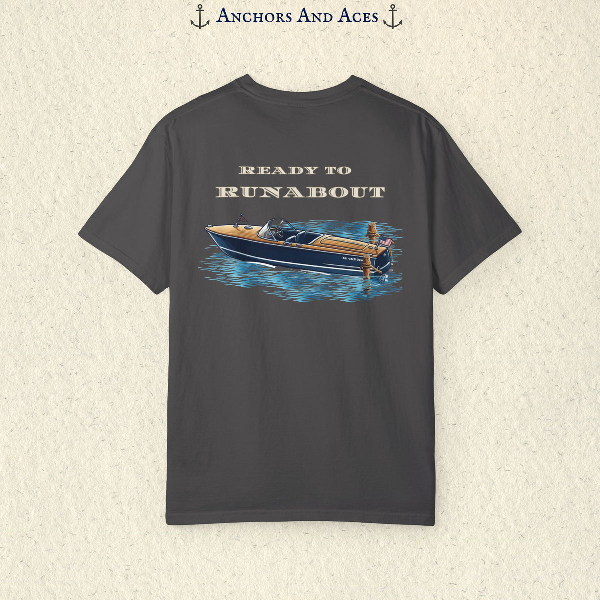 Graphite classic wooden boat T-shirt shown from the back, featuring a vintage runabout on reflective blue water with Ready to Runabout text above the boat.