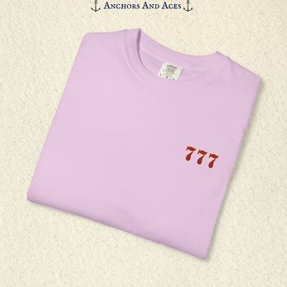 Folded Orchid Lucky 777s T-shirt showing the small red 777 casino emblem on the front chest.