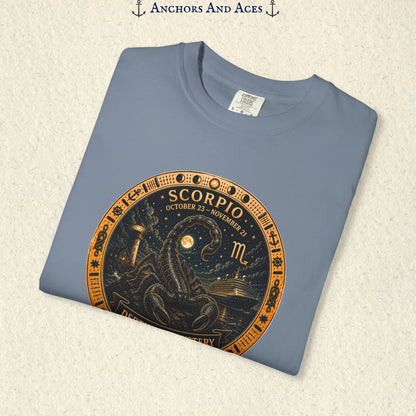 Folded Scorpio zodiac shirt close-up showing scorpion celestial medallion and Depths of Mystery artwork