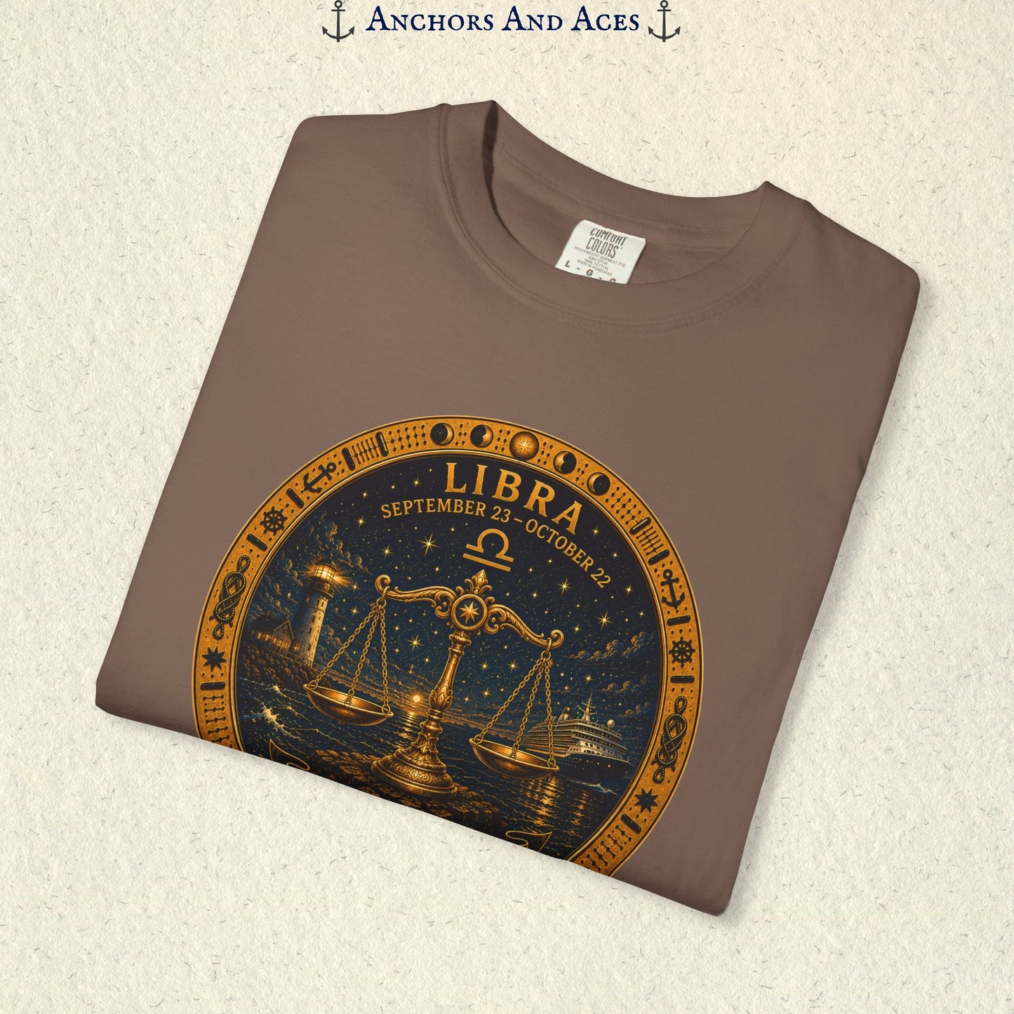 Folded Libra Zodiac Shirt close-up showing the balance scales celestial medallion front graphic.