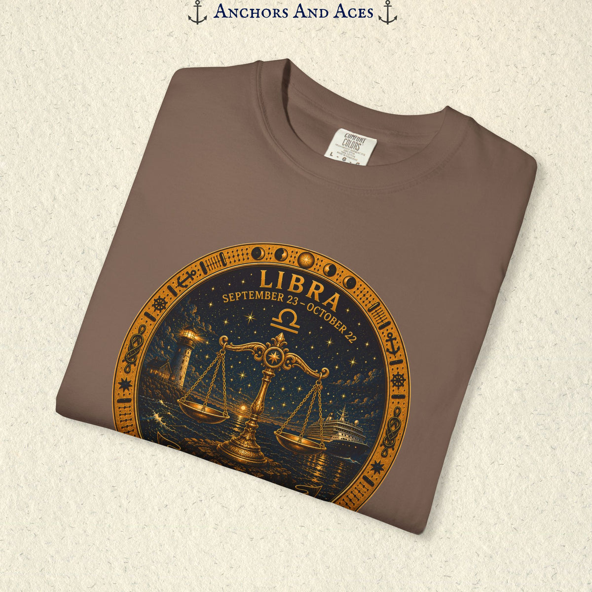 Folded Libra Zodiac Shirt close-up showing the balance scales celestial medallion front graphic.