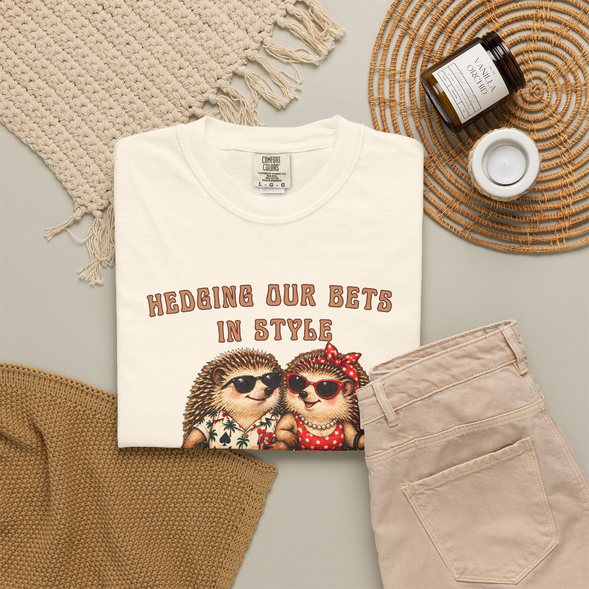 Personalized casino couples graphic tee shown in a styled flat lay with hedgehog gambling artwork and custom text.