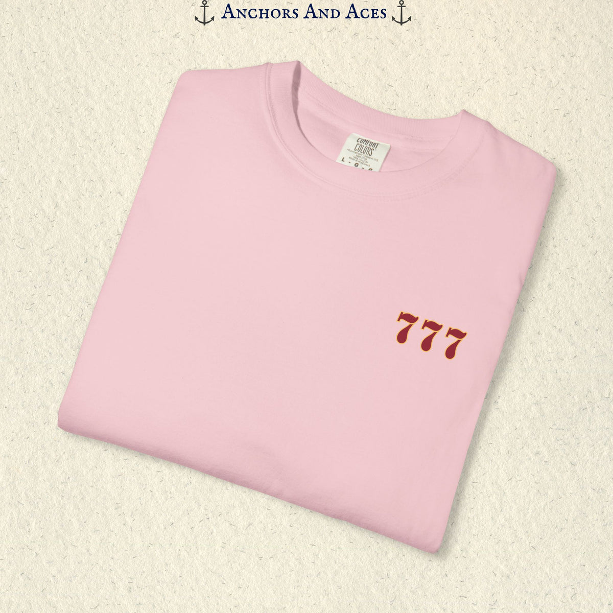 Folded Blossom Lucky 777s T-shirt showing the small red 777 casino emblem on the front chest.
