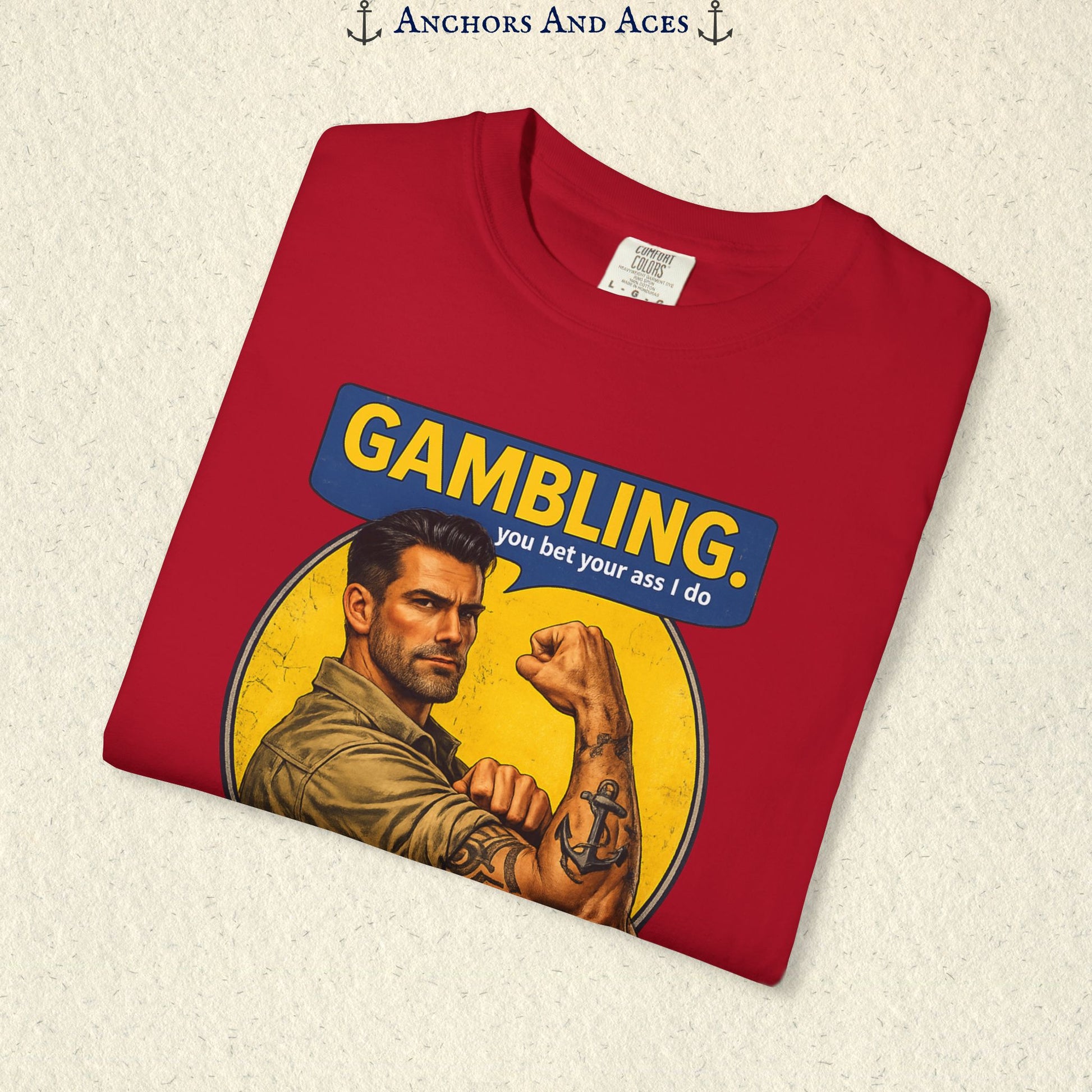 Folded Red funny gambling T-shirt showing the retro strongman flexing beneath bold GAMBLING text.