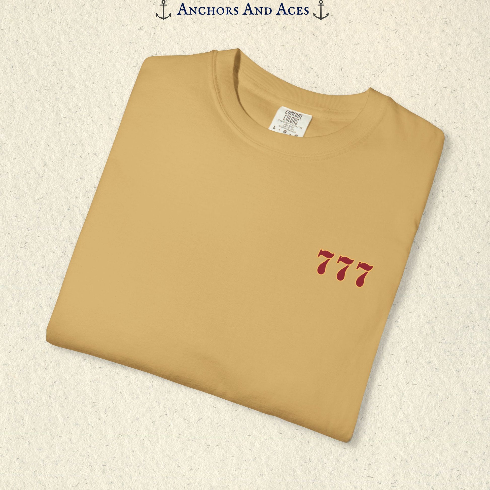 Folded Mustard Lucky 777s T-shirt showing the small red 777 casino emblem on the front chest.