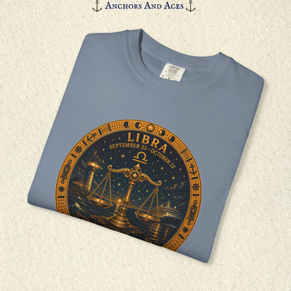 Folded Libra Zodiac Shirt close-up showing the balance scales celestial medallion front graphic.