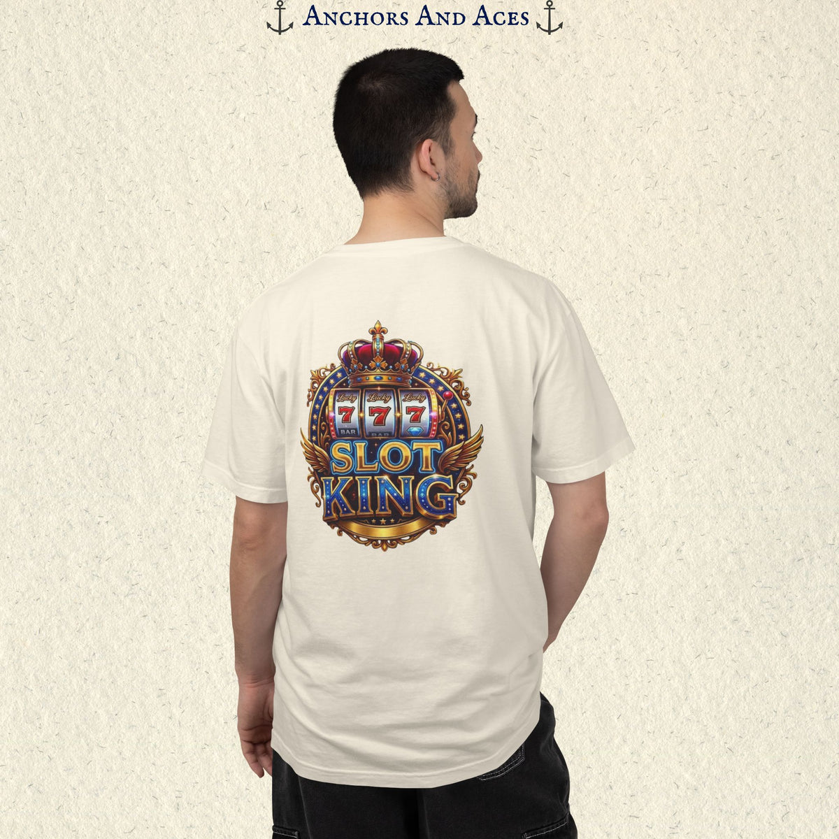 Man wearing an Ivory Slot King T-shirt with the crowned 777 slot machine artwork on the back.