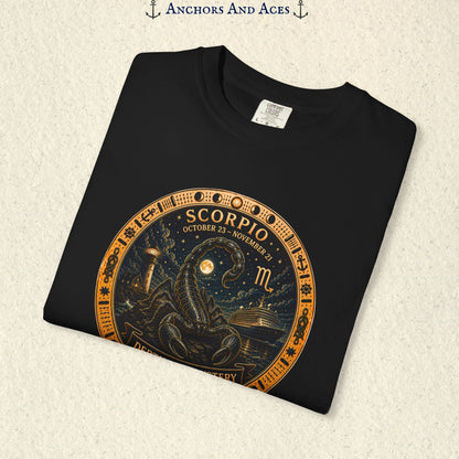 Folded Scorpio zodiac shirt close-up showing scorpion celestial medallion and Depths of Mystery artwork