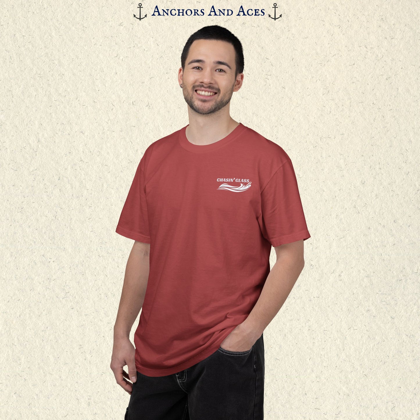 Model wearing a Crimson Comfort Colors 1717 water ski t-shirt from the front, showing the small white Chasin' Glass water-splash logo on the left chest.