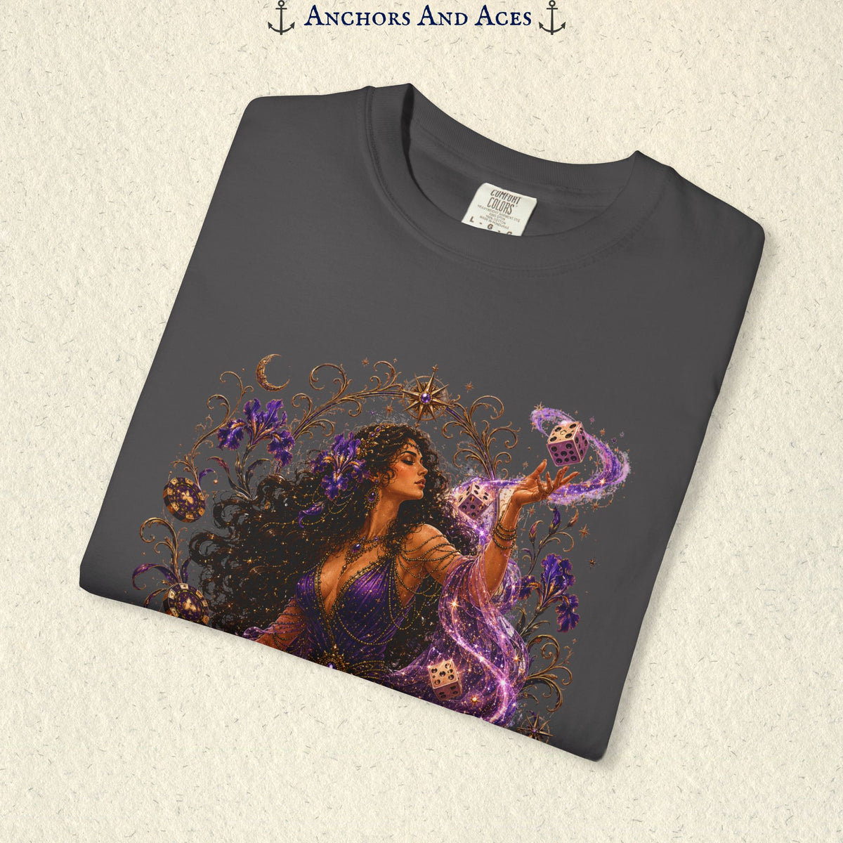 Close-up of Goddess of Chance Art Nouveau graphic on Graphite Comfort Colors tee with illustrated goddess, dice, irises, and gold filigree.