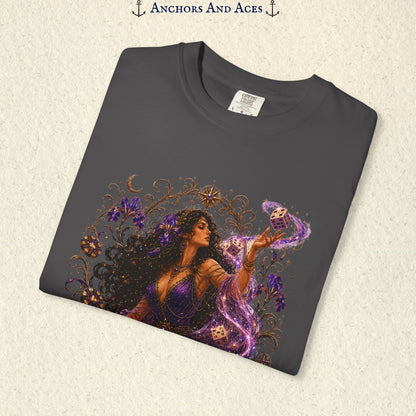 Close-up of Goddess of Chance Art Nouveau graphic on Graphite Comfort Colors tee with illustrated goddess, dice, irises, and gold filigree.